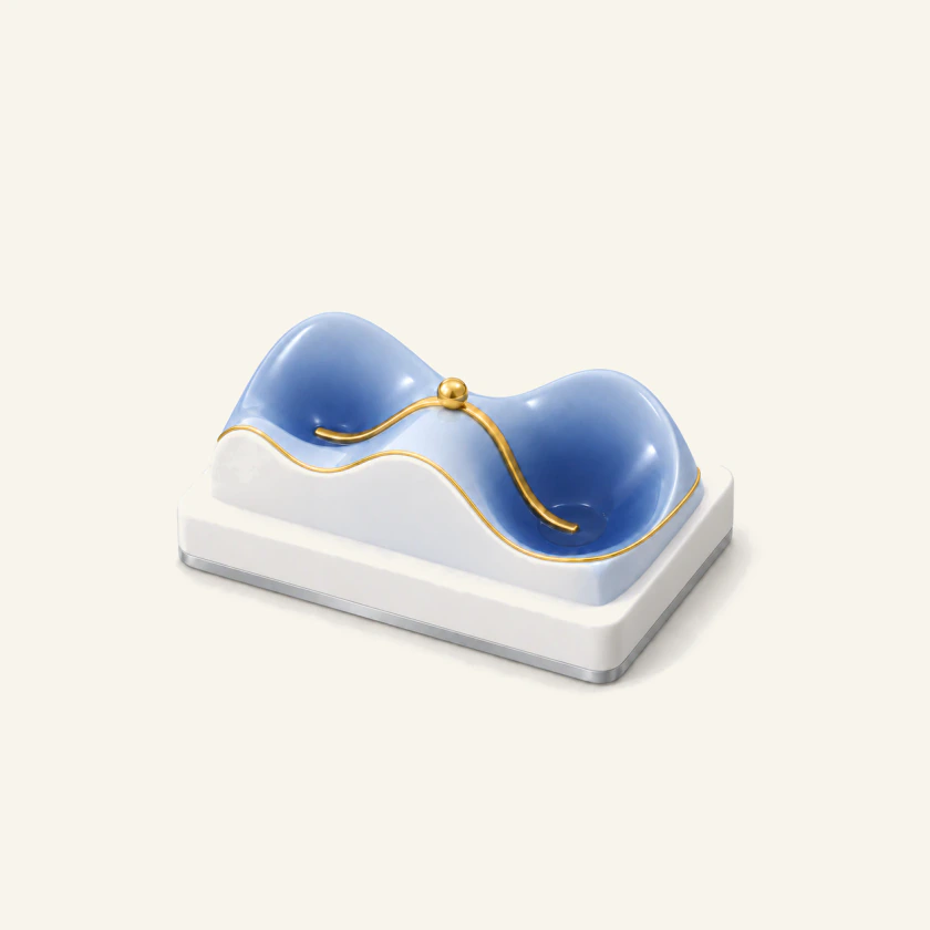 Glazed porcelain relief of a reaction energy landscape: two valleys joined by a saddle, a gold bead on the saddle, a gold channel and a gilded rim